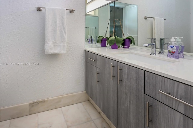 bathroom with vanity and tile patterned flooring