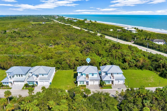 birds eye view of property featuring a water view and a view of the beach