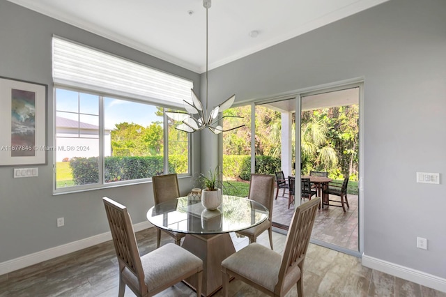 dining room featuring crown molding and wood-type flooring