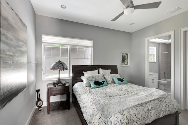 bedroom featuring connected bathroom, ceiling fan, and carpet floors