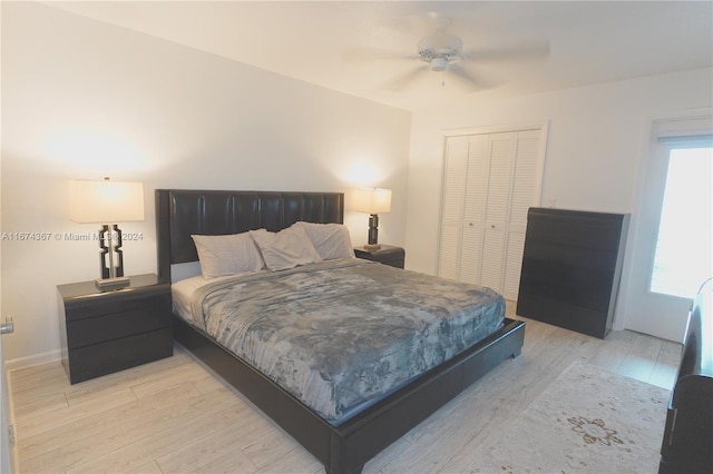 bedroom with light hardwood / wood-style floors, a closet, and ceiling fan