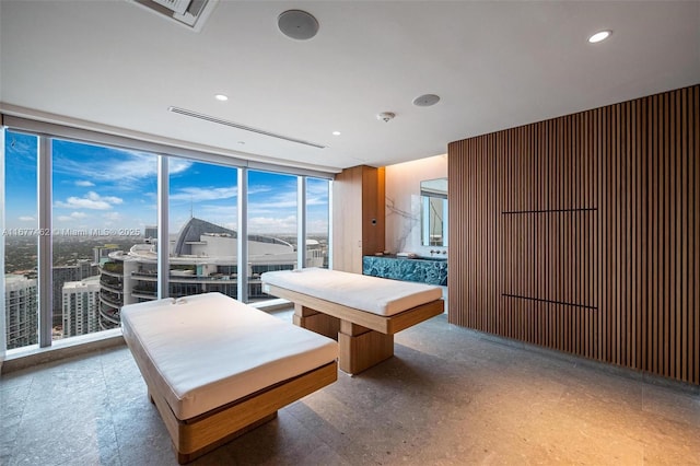 playroom with expansive windows and recessed lighting