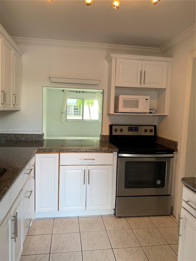 251 Galen Dr Unit 204E, Key Biscayne, FL 33149 - kitchen featuring stainless steel electric range, white microwave, crown molding, white cabinetry, and dark stone counters