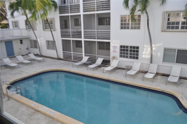 view of pool featuring a patio area