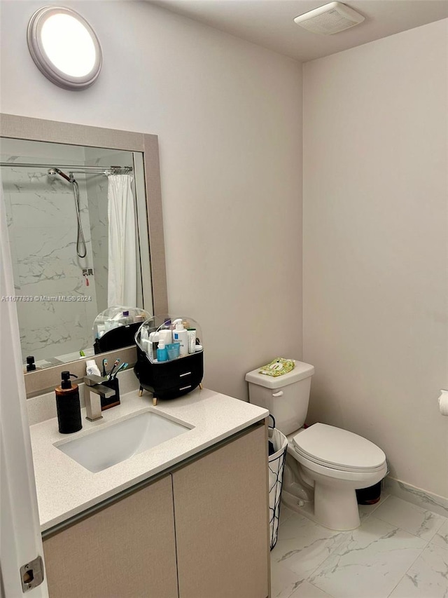 bathroom with vanity, toilet, and a shower with curtain