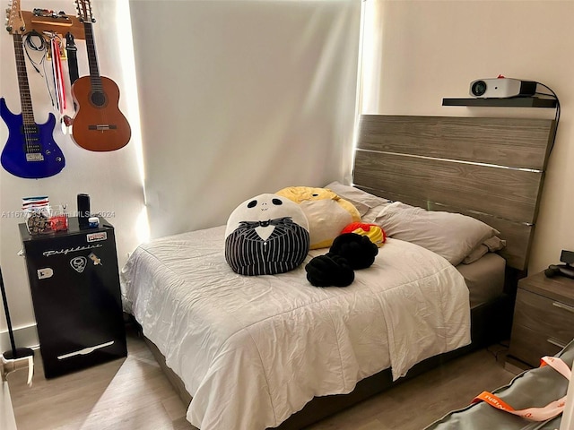 bedroom featuring hardwood / wood-style flooring