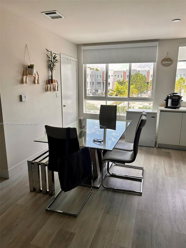 dining area with wood-type flooring