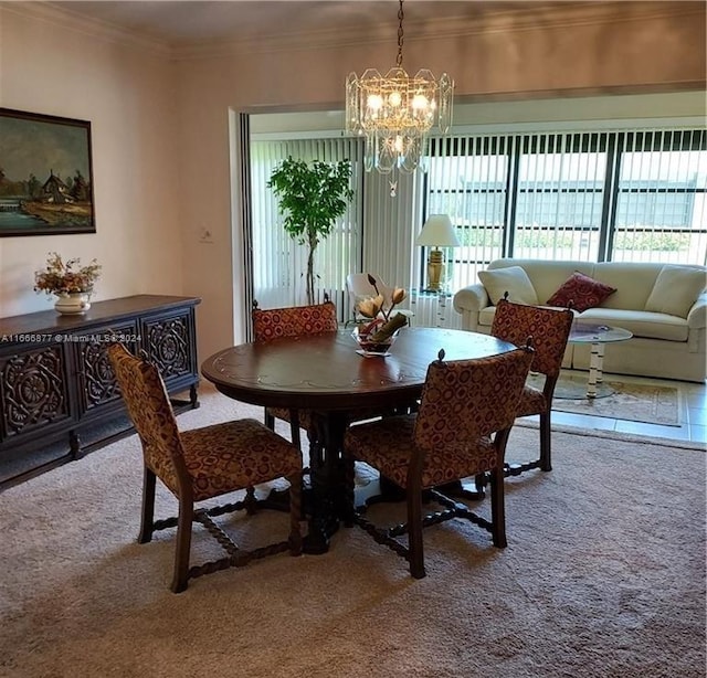 carpeted dining room featuring crown molding and an inviting chandelier