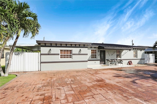 view of front of property featuring a patio area