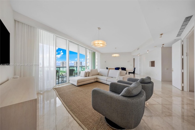 living room with floor to ceiling windows