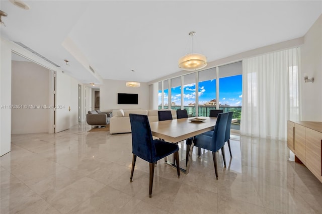 dining space featuring expansive windows