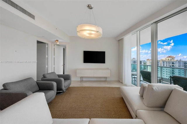 living room with light tile patterned flooring