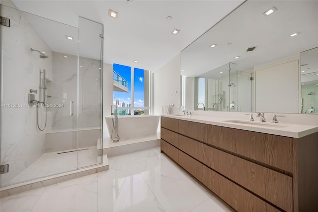 bathroom featuring vanity and separate shower and tub