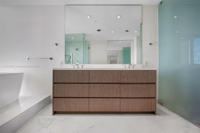 bathroom with vanity and independent shower and bath