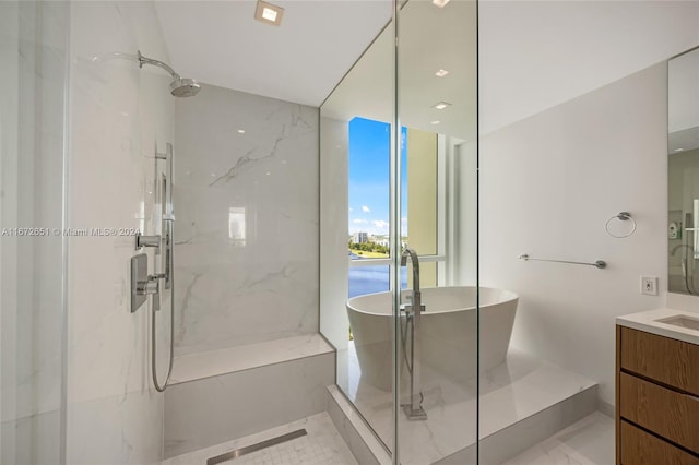 bathroom featuring vanity and independent shower and bath