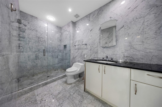 bathroom with vanity, an enclosed shower, tile walls, and toilet