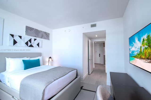 bedroom featuring light hardwood / wood-style floors