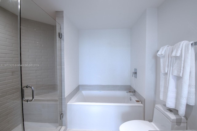 bathroom with toilet and plus walk in shower