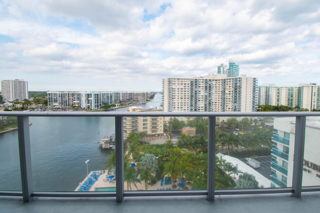 balcony featuring a water view