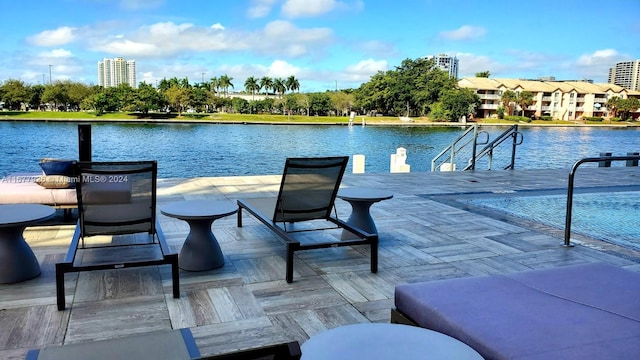 view of pool with a water view