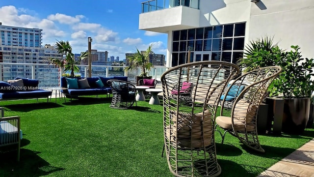 view of yard featuring a balcony