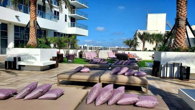 view of property's community with a patio area