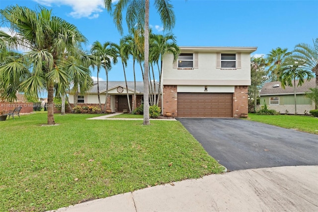 view of front facade with a garage and a front lawn