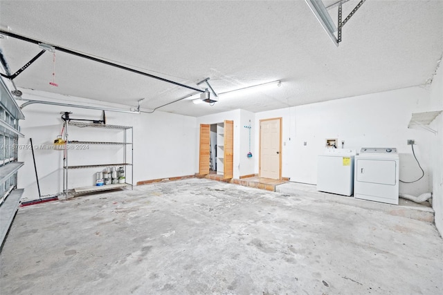 garage featuring a garage door opener and washing machine and clothes dryer