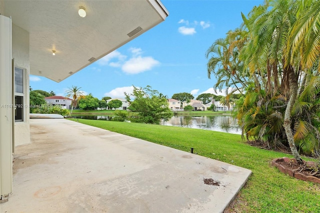 view of patio with a water view