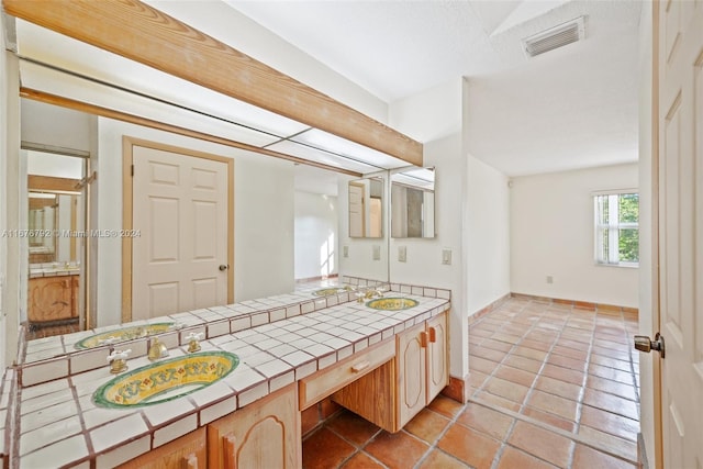 bathroom with vanity and tile patterned floors