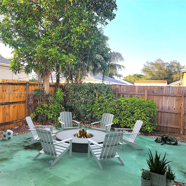 view of patio / terrace with an outdoor fire pit