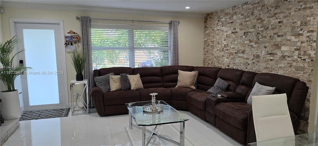 living room featuring crown molding and light tile patterned floors