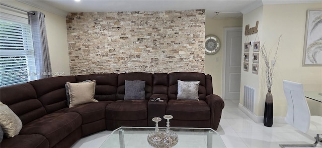 living room featuring crown molding and light tile patterned floors