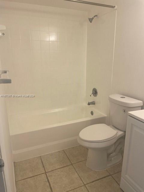 1068NBENOIST Farm Rd Unit 105, West Palm Beach, FL 33411 - bathroom with tile patterned floors, toilet, shower / tub combination, and vanity
