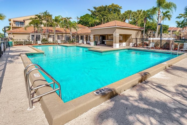 view of swimming pool with a patio area