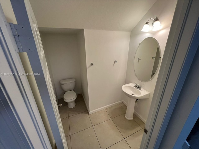 bathroom with tile patterned floors and toilet