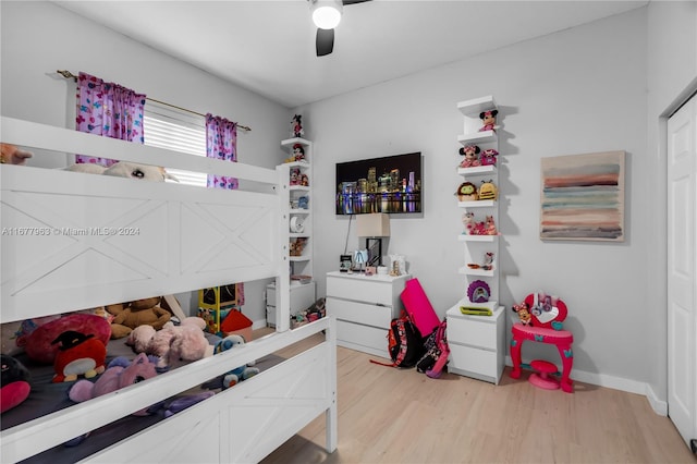 bedroom with ceiling fan and light hardwood / wood-style flooring