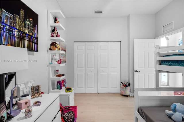 bedroom with a closet and light wood-type flooring