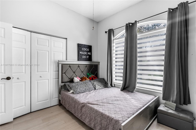 bedroom featuring a closet and light wood-type flooring