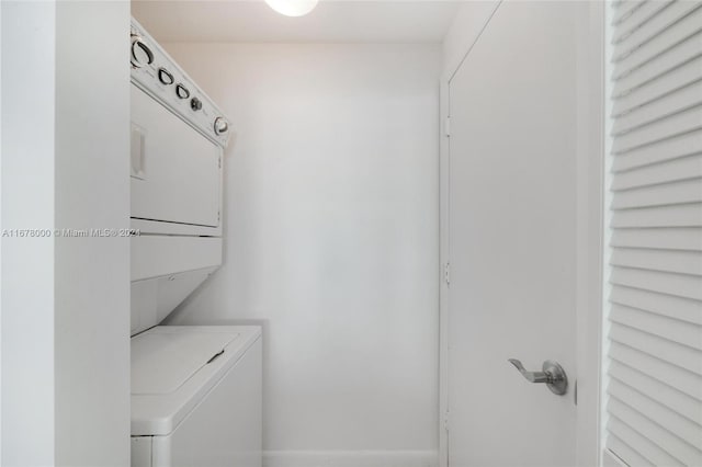 laundry room featuring stacked washing maching and dryer