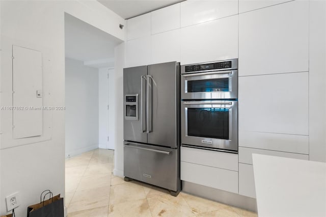 kitchen featuring white cabinetry and stainless steel appliances