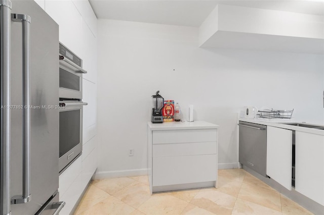 kitchen with white cabinets and stainless steel appliances