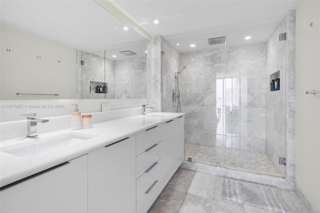 bathroom with vanity and walk in shower