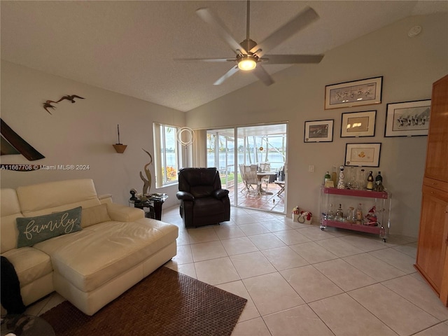 tiled living room with vaulted ceiling and ceiling fan