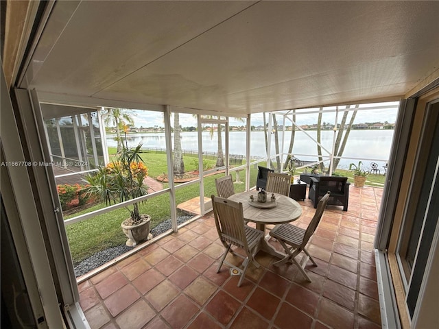 sunroom with a water view