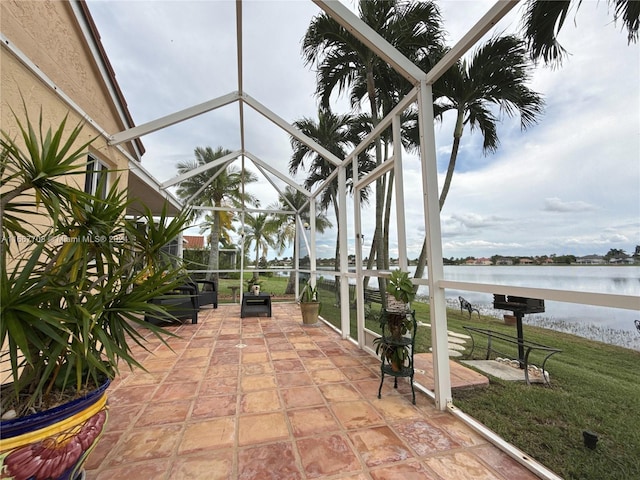 exterior space with a water view and a lanai