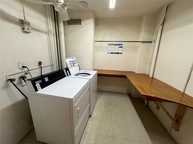 laundry room with separate washer and dryer and ceiling fan