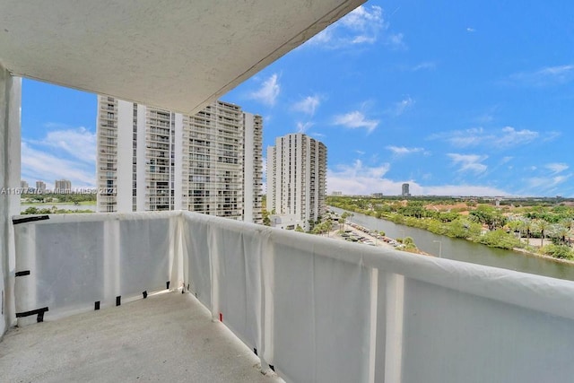 balcony featuring a water view