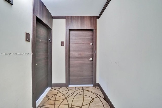 entryway featuring ornamental molding