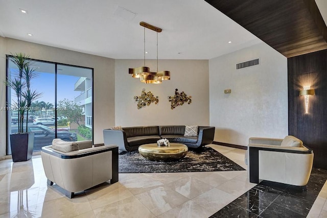 living room featuring a notable chandelier